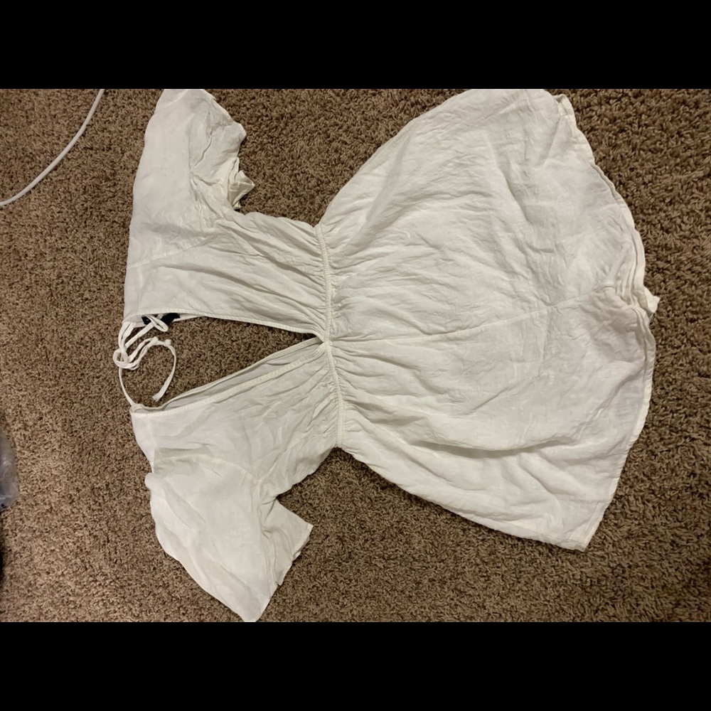 White romper with open back